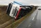 Olt: Un tir încărcat cu lactate s-a răsturnat, după ce a derapat